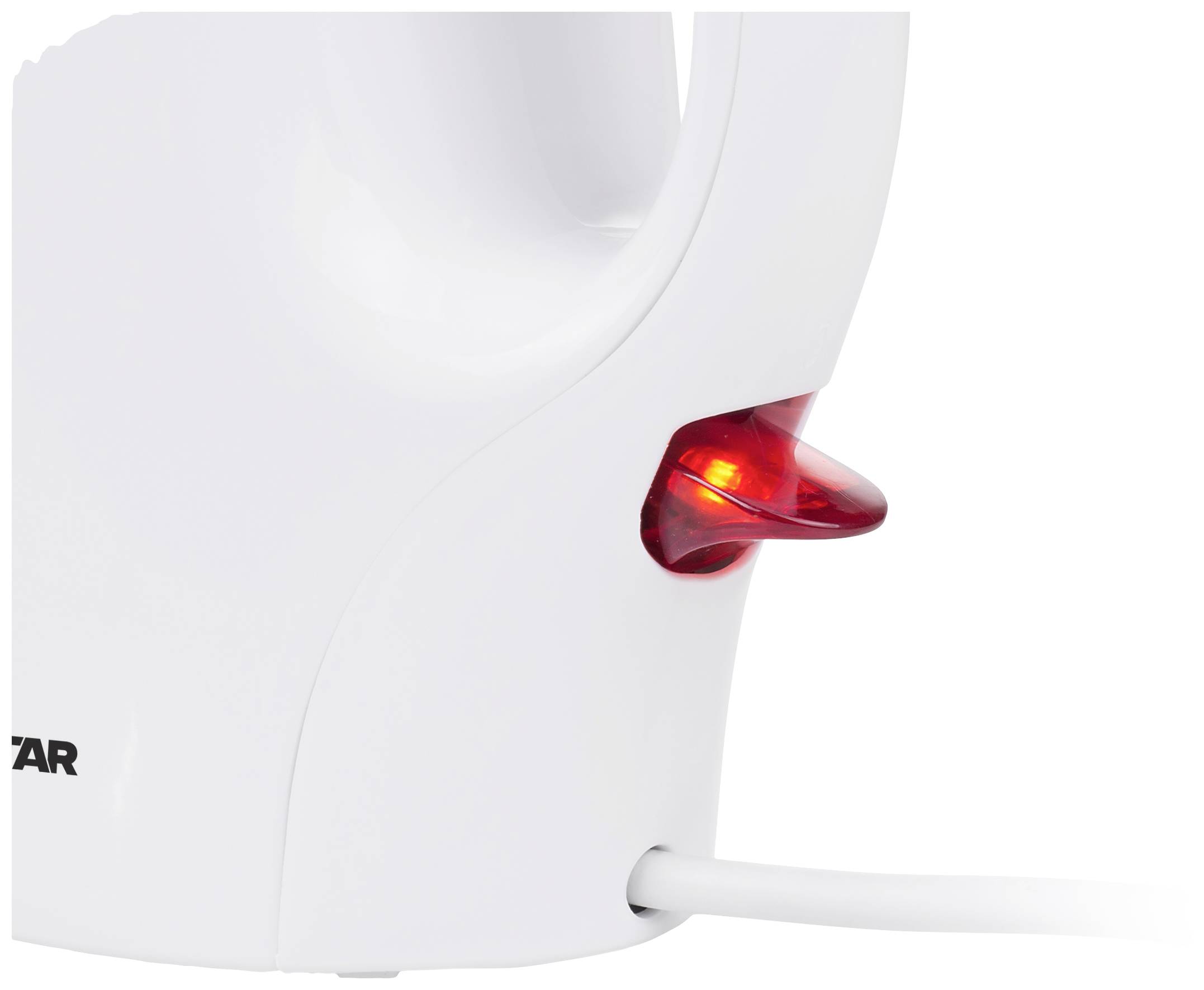 A white electric kettle with a red illumination indicator, showing that the appliance is in operation.
