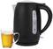 Black kettle next to a cup of tea. The kettle has a transparent water level indicator up to 1.7 litres.