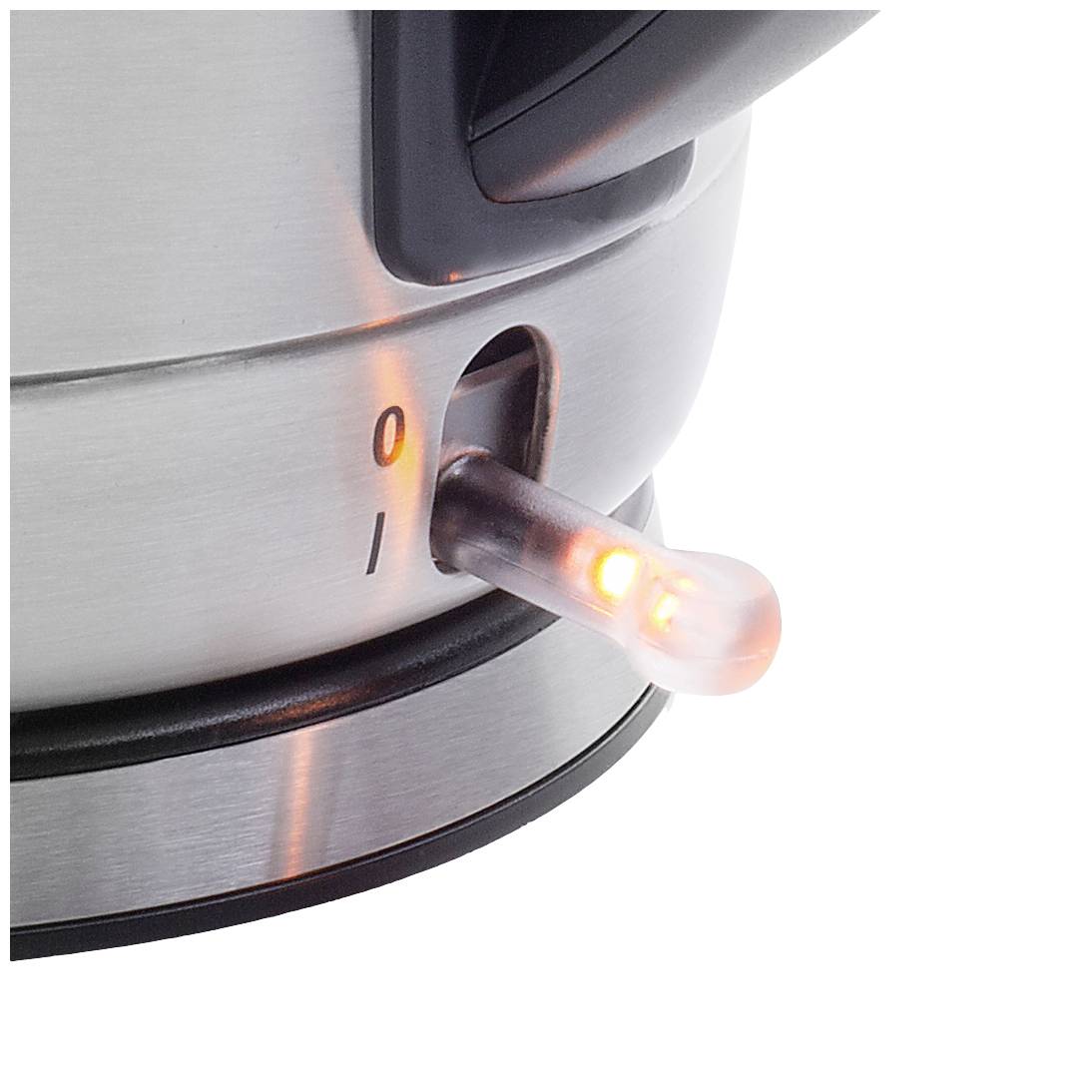 A kettle in close-up shows a glowing orange indicator light signalling that it is in operation.