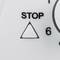 Image section of a microwave keyboard showing the 'Stop' button and part of the numeric keypad with numbers.