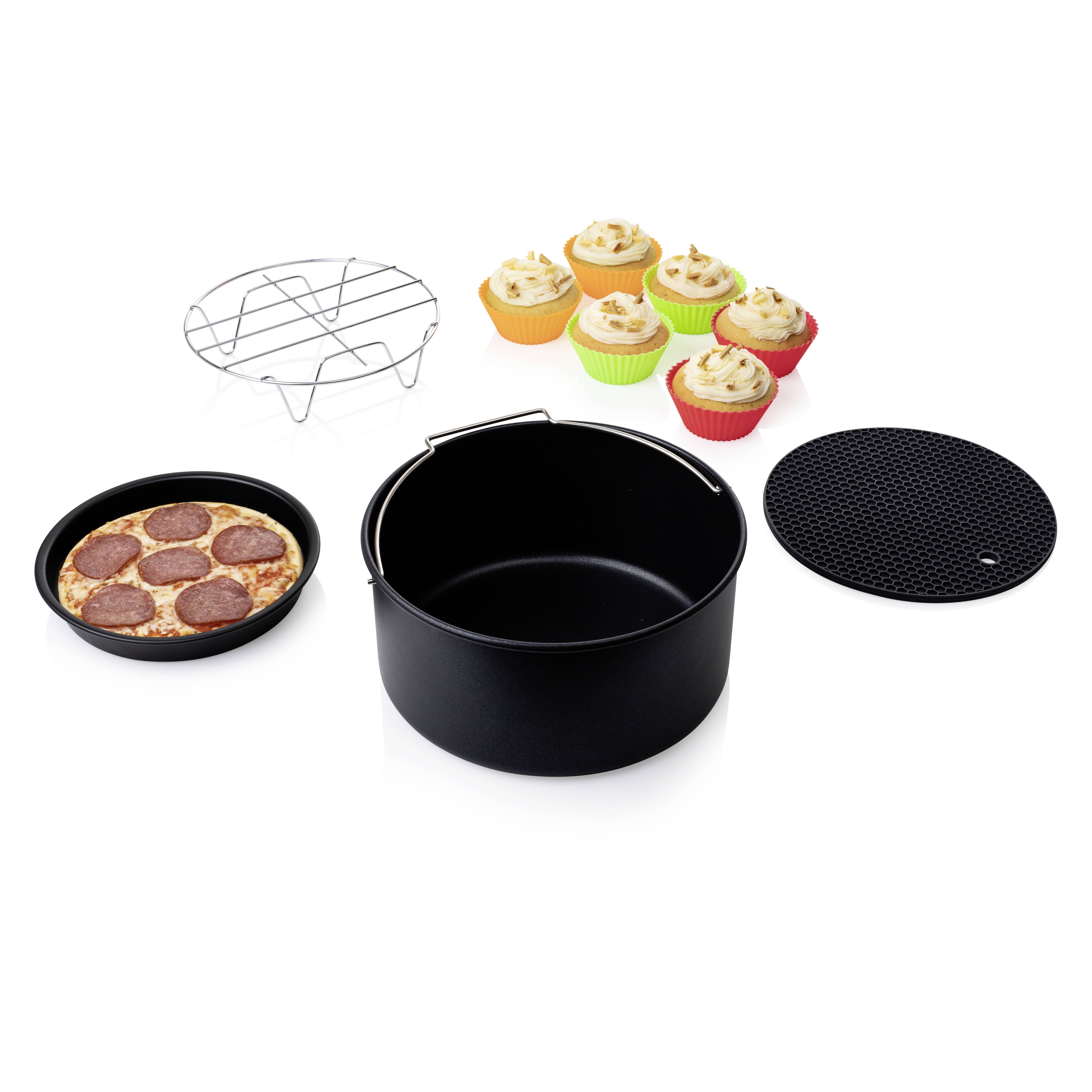 A selection of baking utensils: a black baking dish, a wire rack, a baking tray with mini pizzas, a trivet and six muffins.