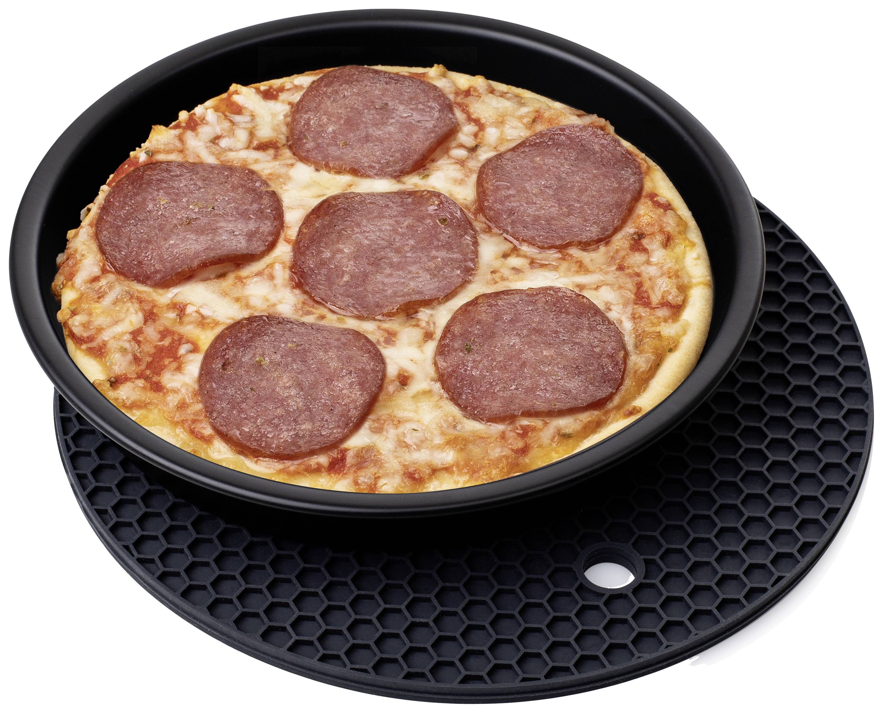 A pizza with salami on a black round tray.