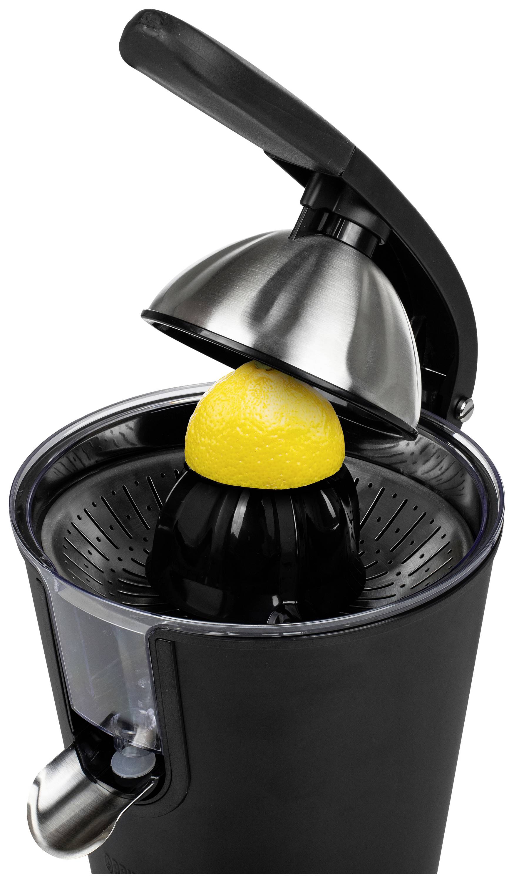 Electric citrus juicer with a halved lemon on the pressing cone. Black housing, stainless steel accents, side juice outlet.