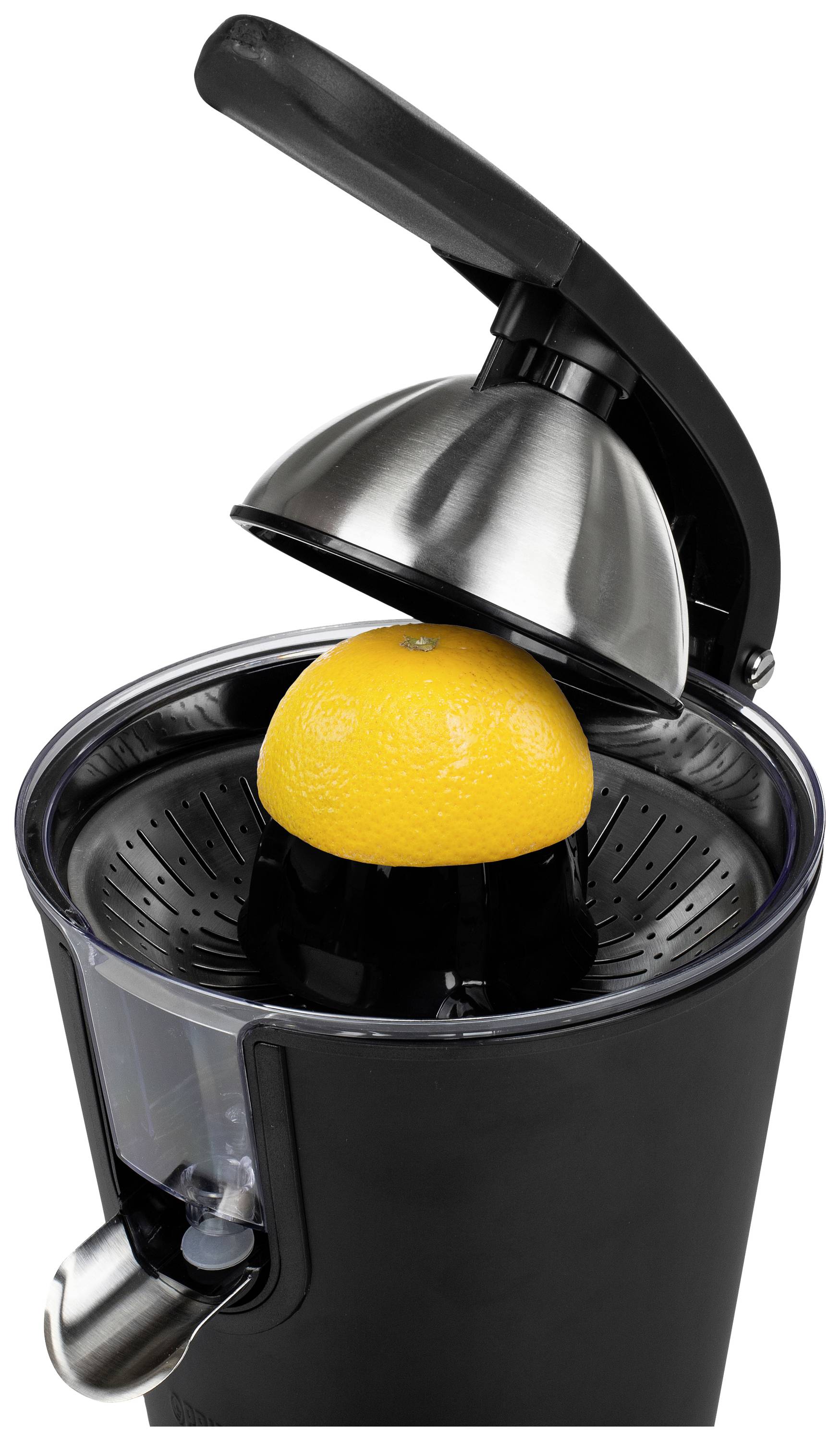 Electric citrus juicer with a black casing pressing half an orange. Focus on the juicer with a stainless steel cap.
