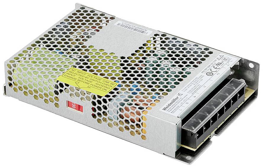 Metallic power supply with ventilation slots, yellow warning label, and multiple connection terminals on one side.