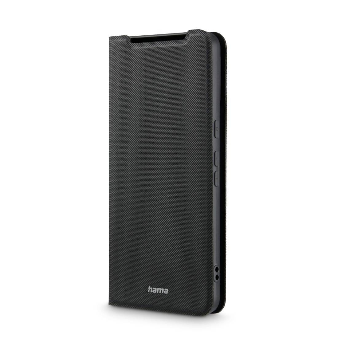 A black smartphone case by the brand 'hama' with texture, standing upright, showing the side buttons and the camera opening.