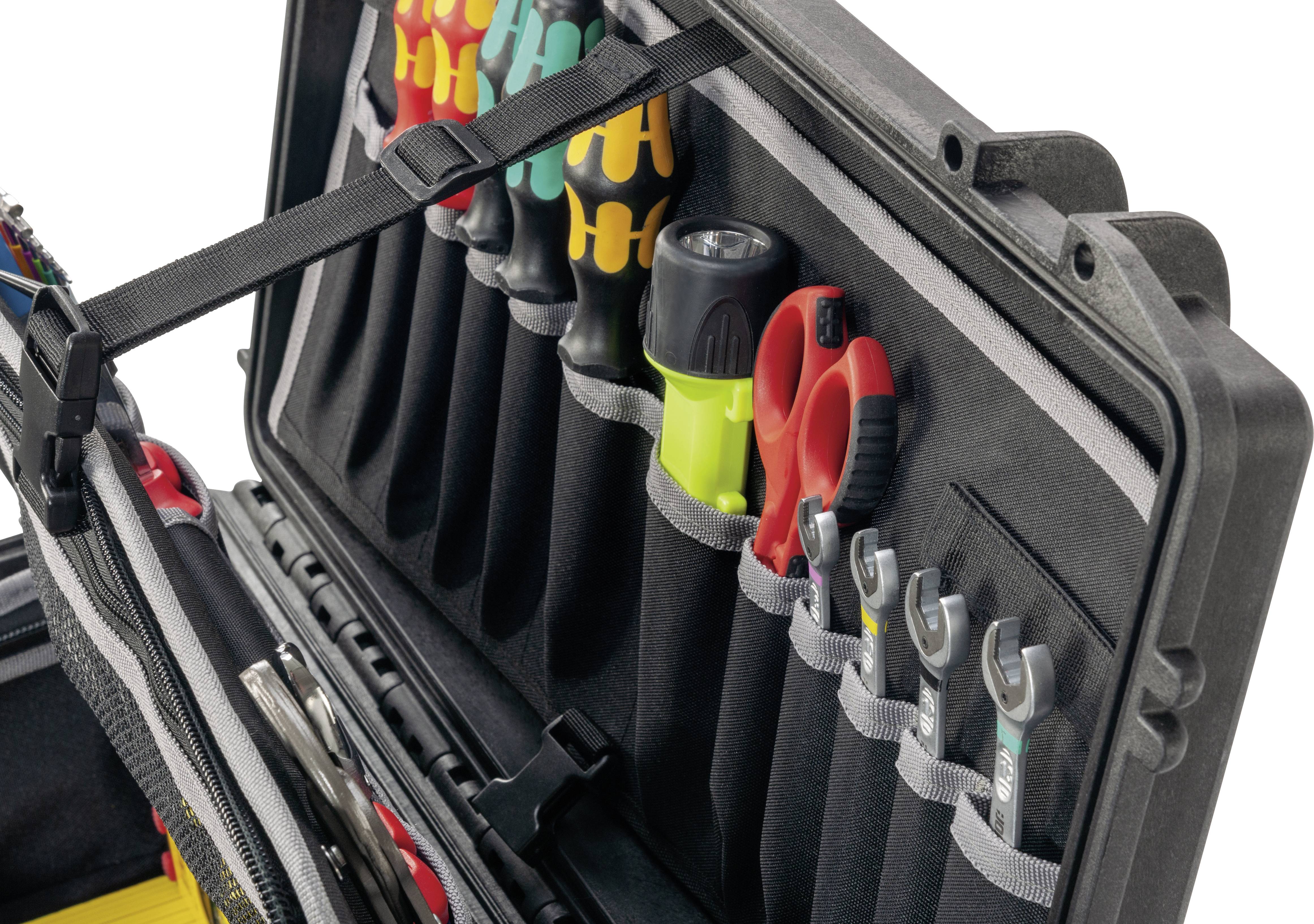 Toolbox with various tools, including screwdrivers, spanners and insulated pliers, sorted in compartments.
