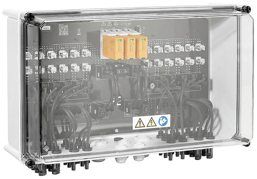 A distribution board with a transparent casing, showing multiple cables and switches inside. Electrical hazard warning notices are visible.