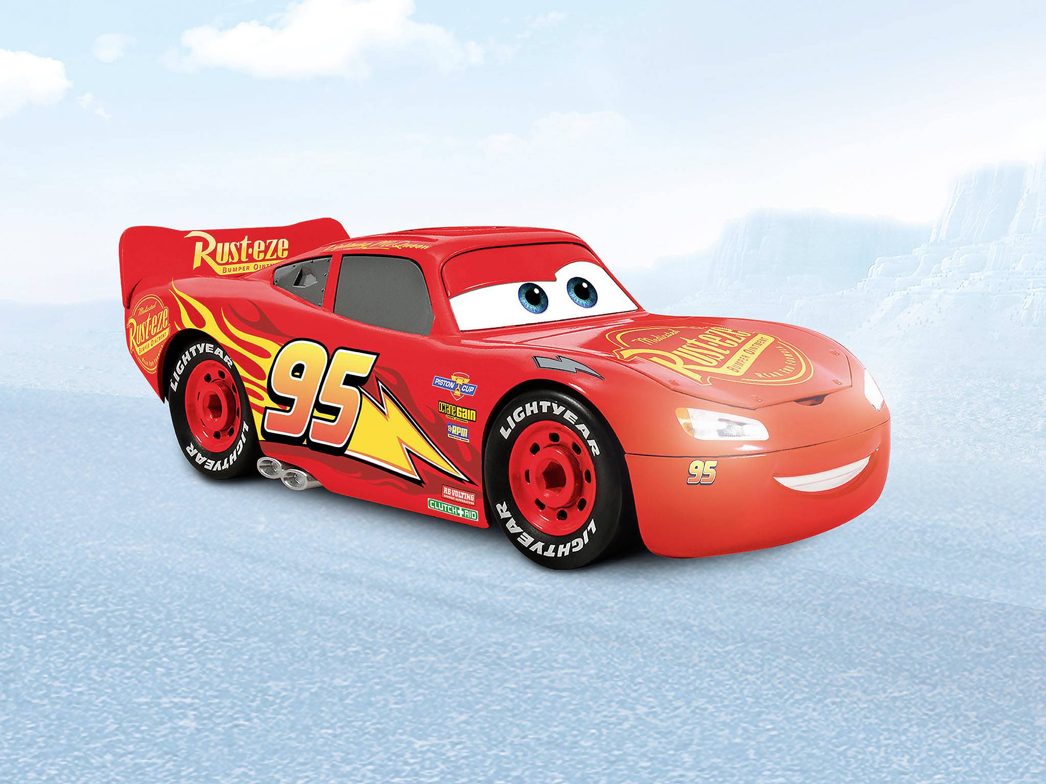 A red, animated racing car with large eyes and the number '95' on its side is standing on a blue surface.