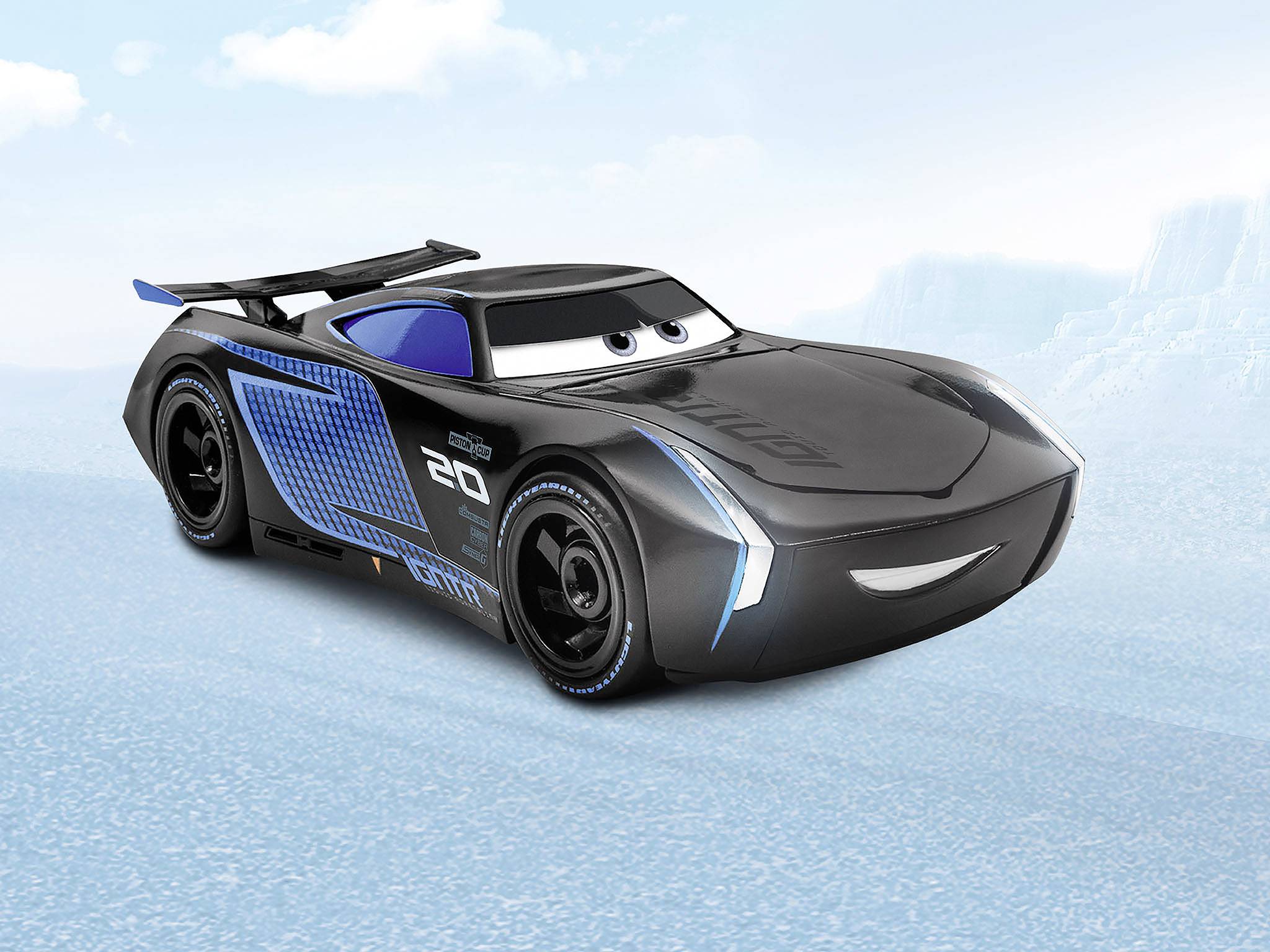 A black and blue cartoon car with large eyes and racing stripes stands on a road against a blue sky background.