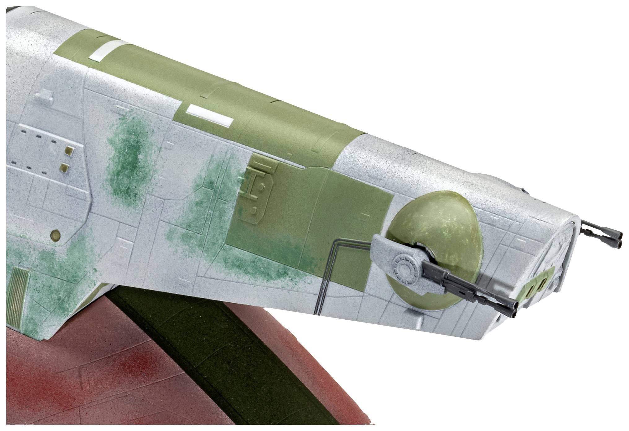 A model of a spacecraft with white and green paintwork, wings, and guns. The design is futuristic and highly detailed.