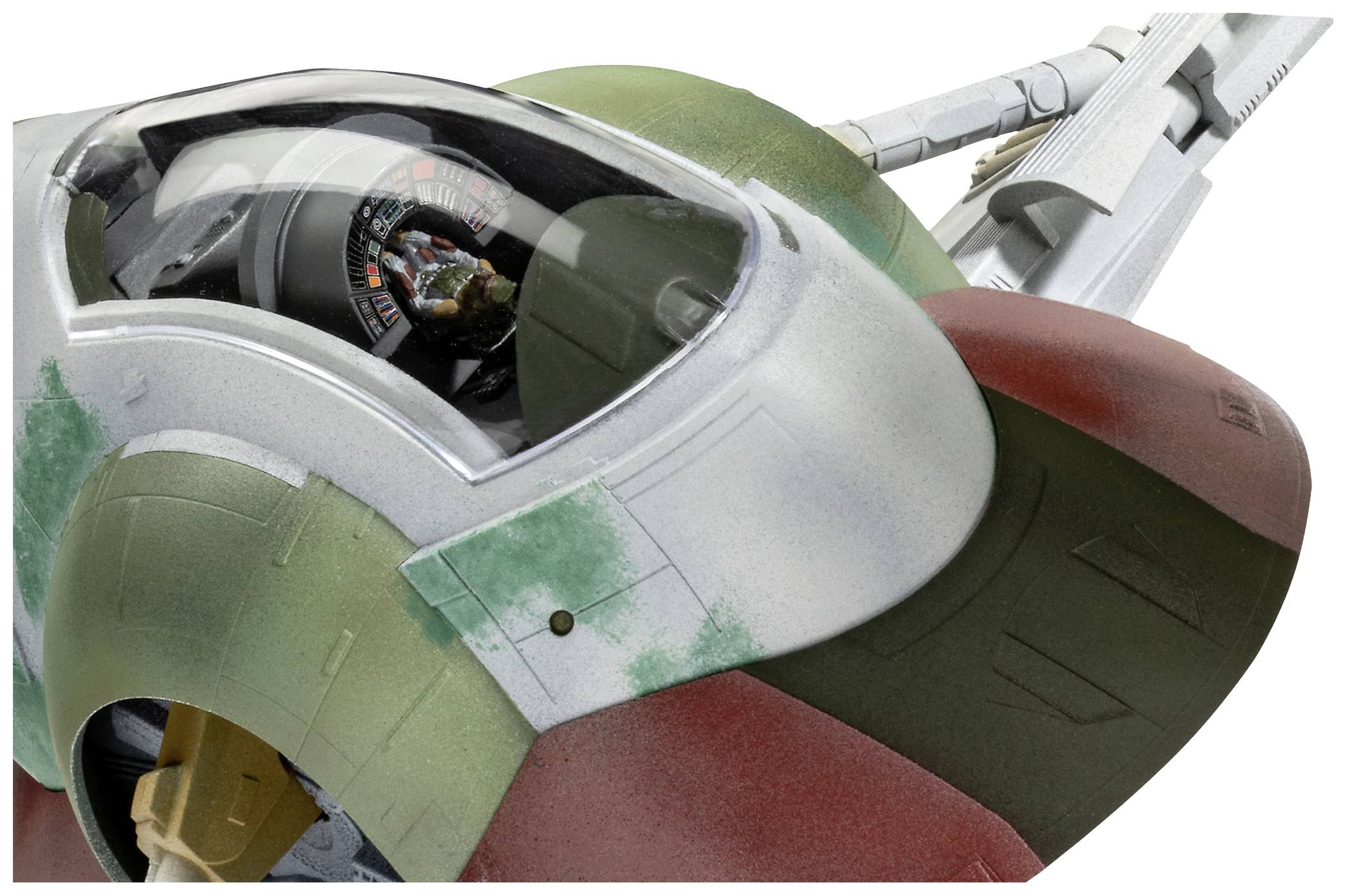 Spacecraft model with camouflaged exterior in red and green, cockpit with visible instruments.