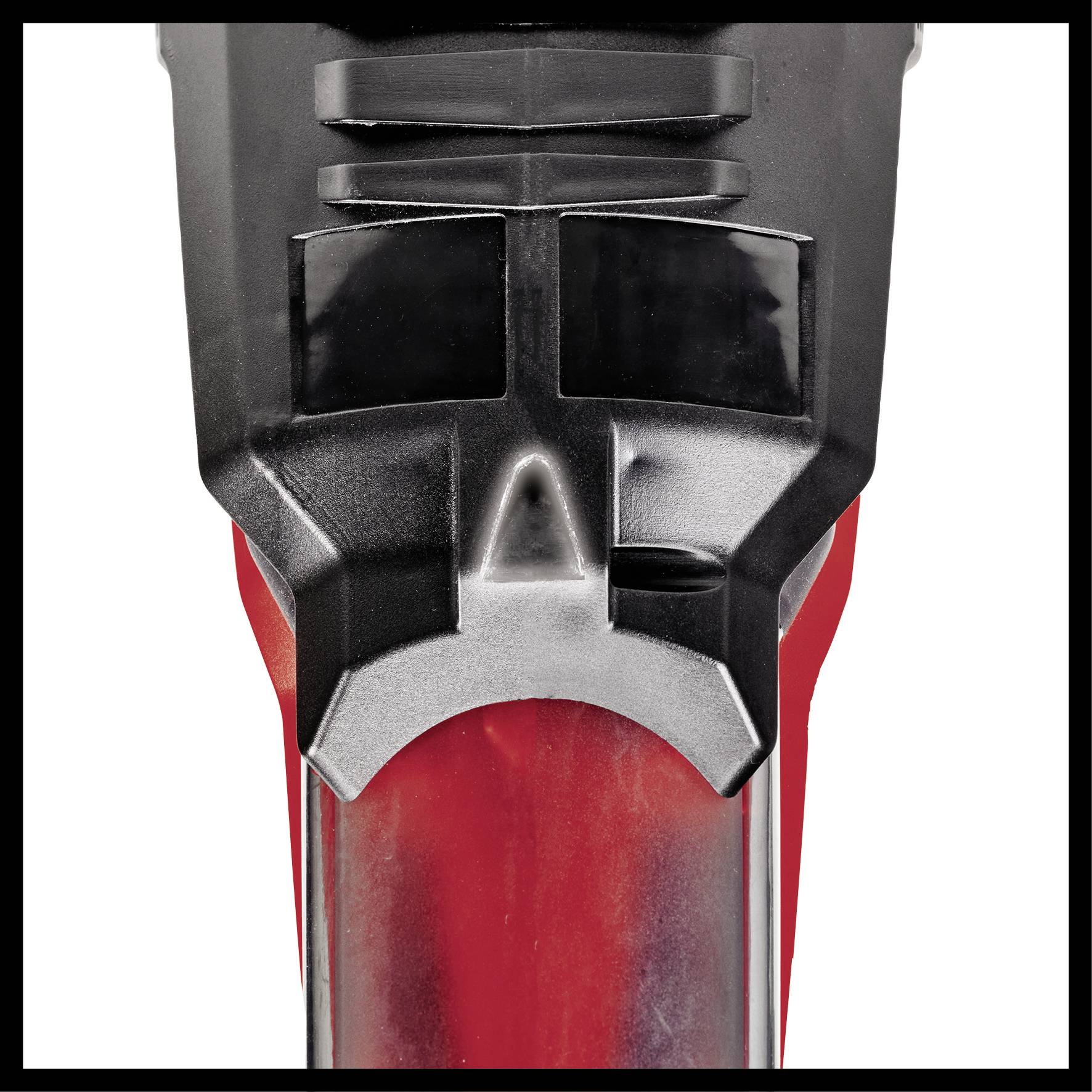 Close-up of part of an electrical device with a red and black casing, possibly a tool or household appliance.