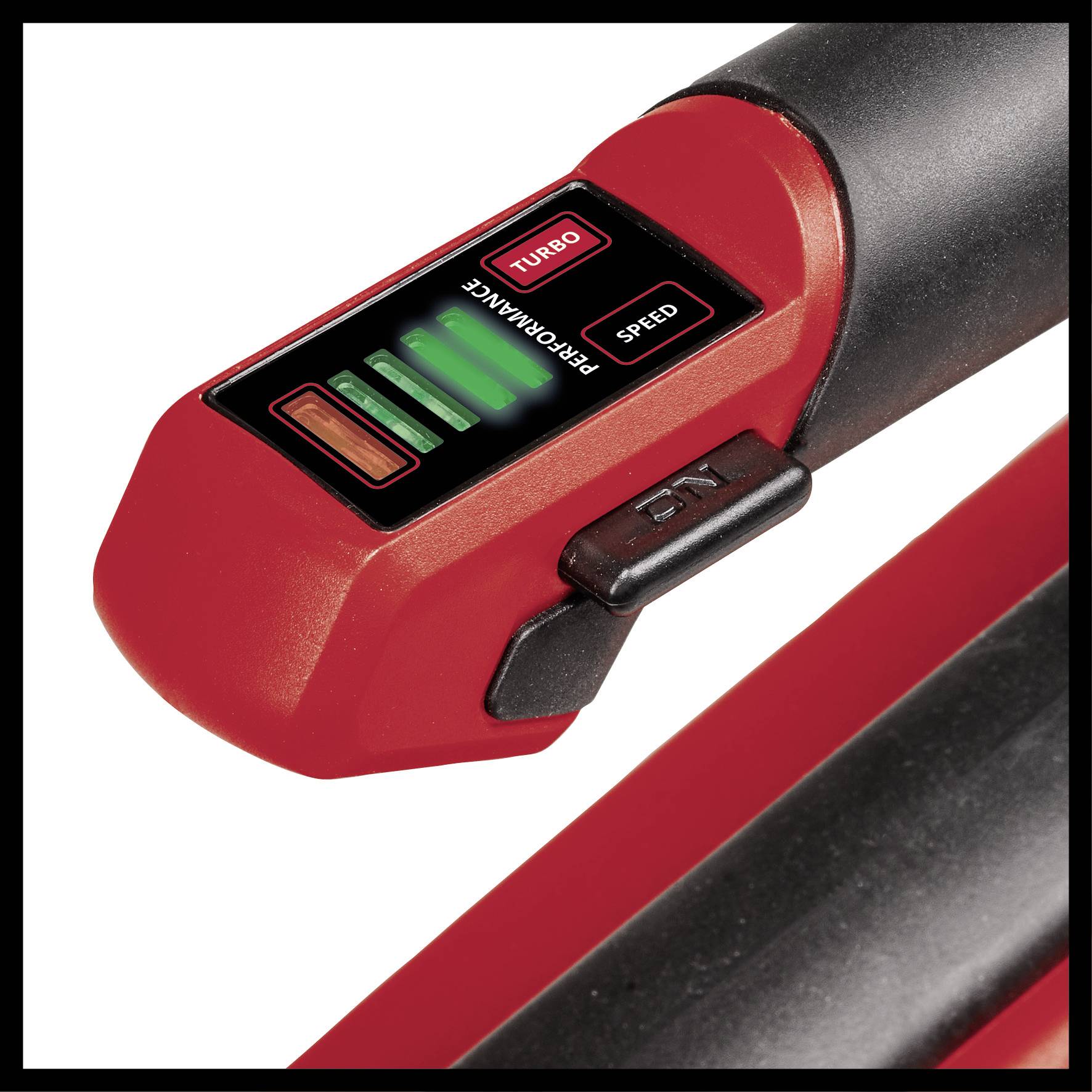 Close-up of a red electronic device with a display. It shows illuminated bars and the words 'Turbo', 'Performance', 'Speed'.