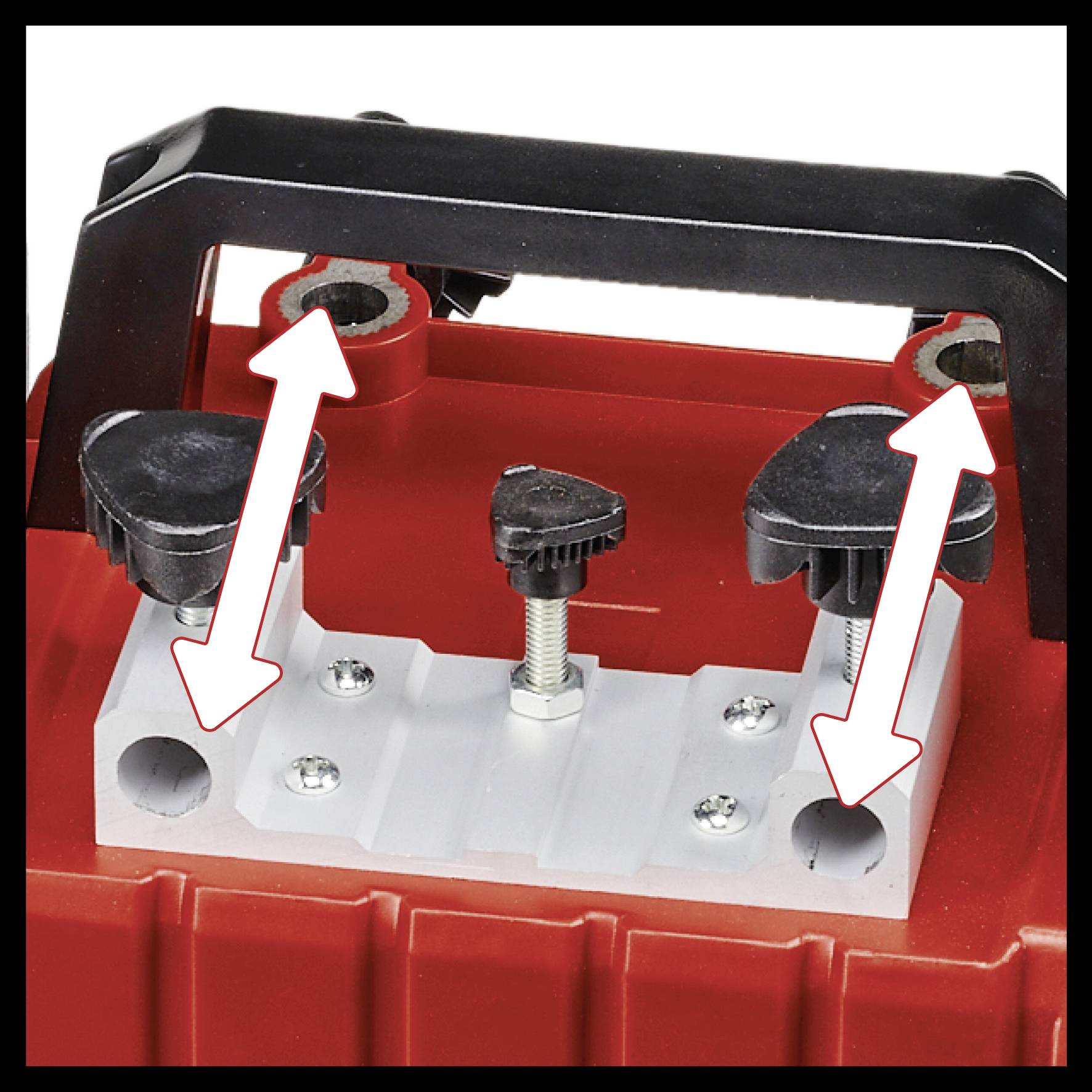 Four red and white arrows point to mounting bolts of a vehicle battery holder, which serves for secure installation.