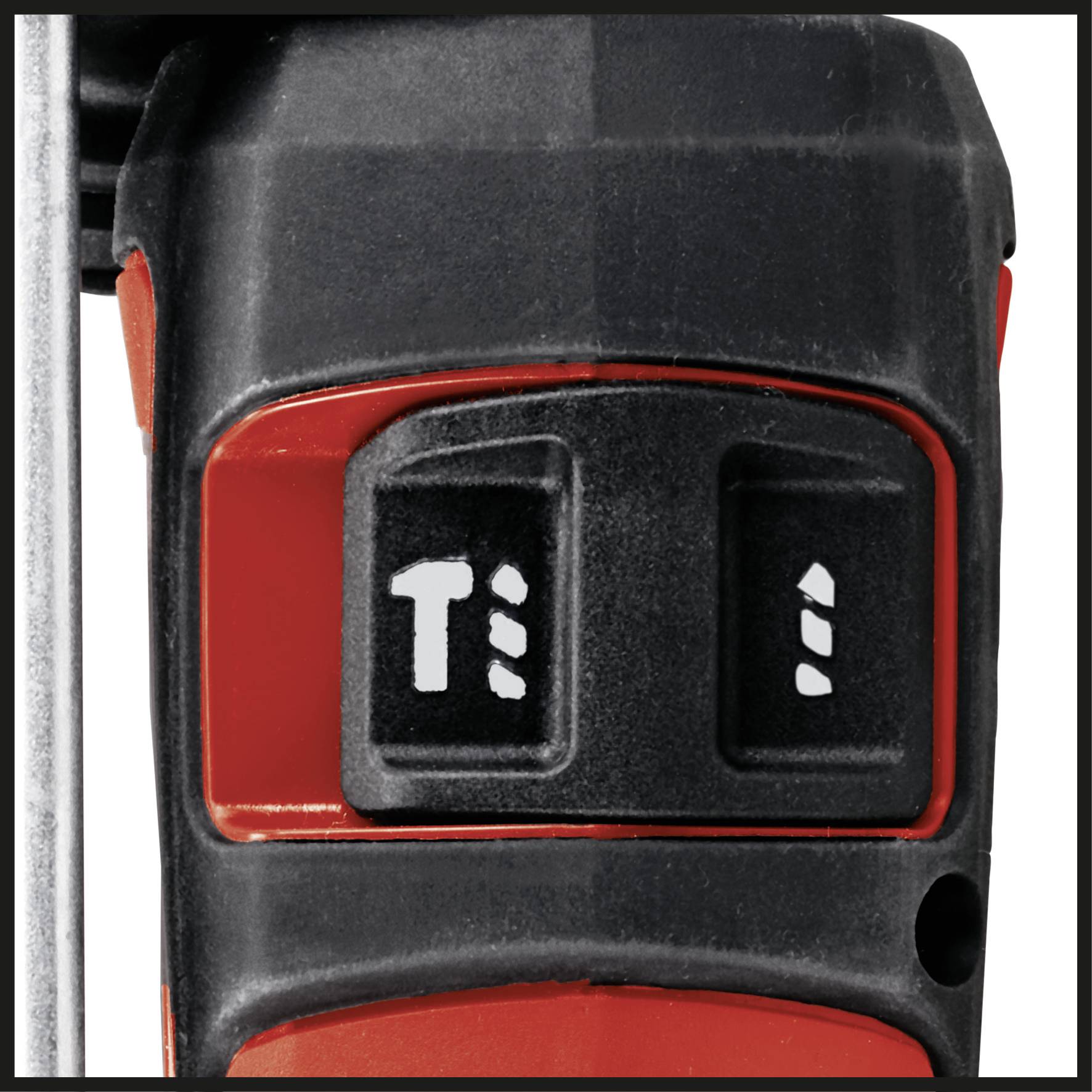 A drill switch on a tool with two settings, left marked 'T' and right with an arrow symbol, on a black and red background.