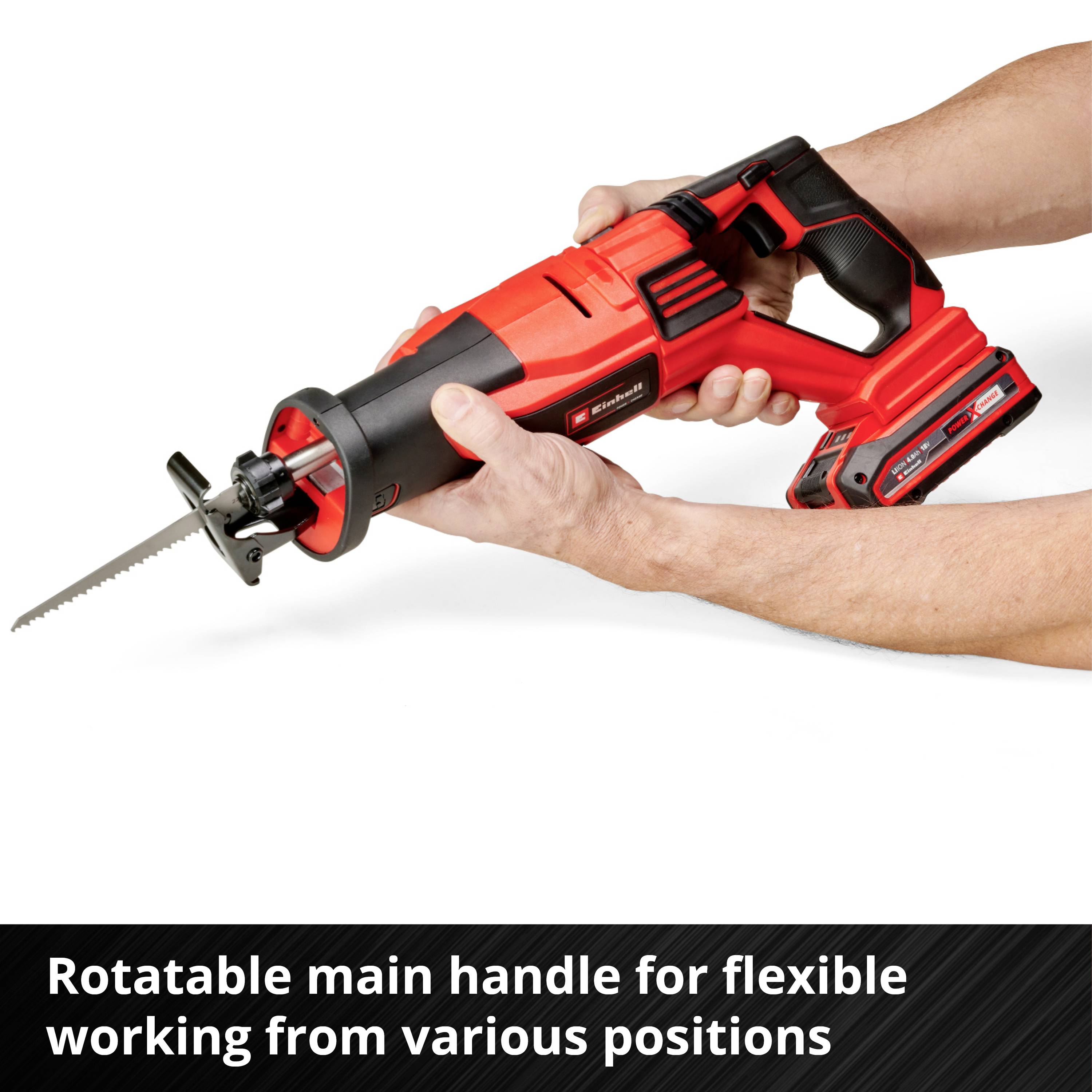 A red electric power tool with a long saw blade. One hand is holding the device, which has a rotatable main handle for flexible working.