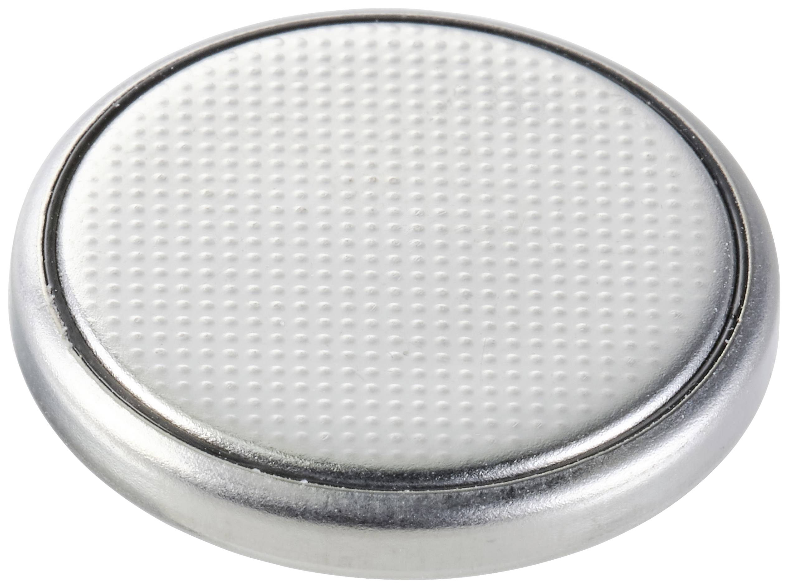 Silver button cell battery with structured surface and smooth edge.