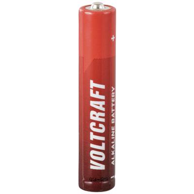 Red alkaline battery with 'Voltcraft' printed on it. Positive terminal visible at the top.