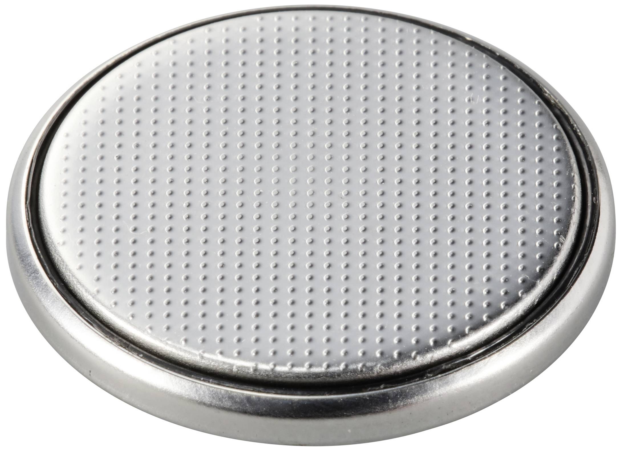 A round button cell battery with a silver, dotted surface, typical of batteries used in watches and small electronic devices.