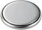 A round button cell battery with a silver, dotted surface, typical of batteries used in watches and small electronic devices.