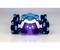 Toy car with blue and black wheels driving on a smooth surface. Front lights shining brightly.