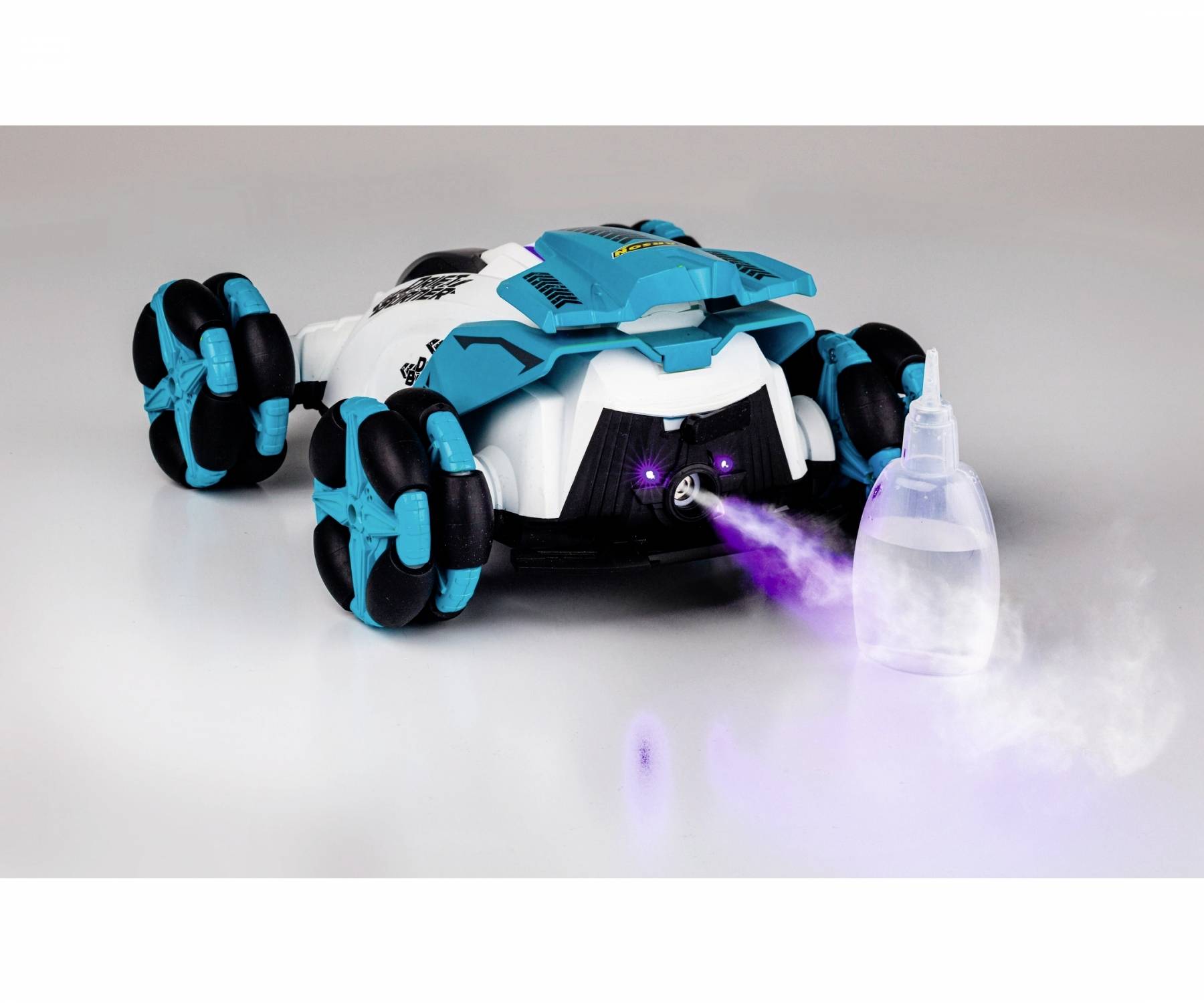 A remote-controlled car is spraying purple smoke from a small attached bottle. The car has blue-black wheels.