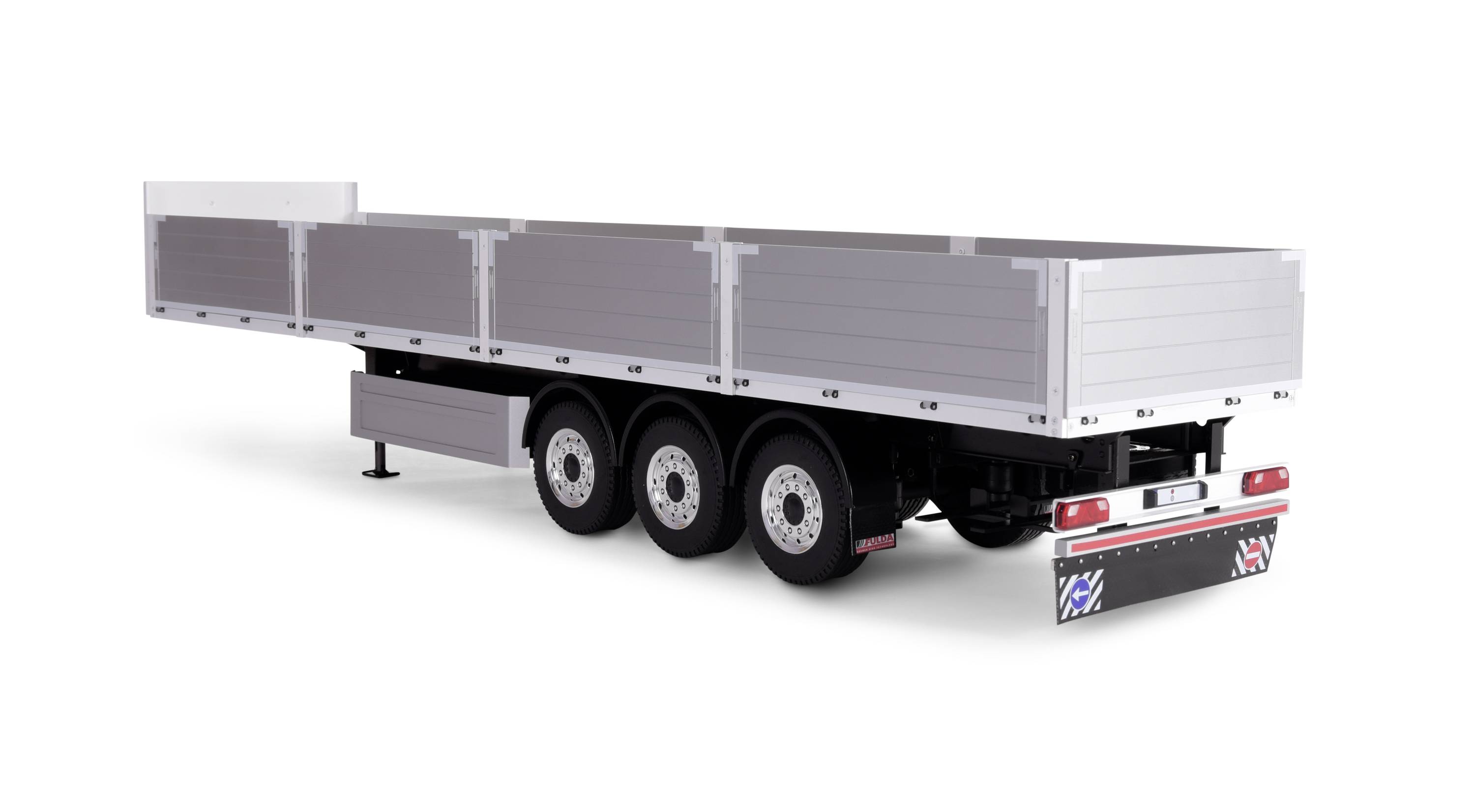 A silver, three-axle lorry trailer with open side walls, standing on a white background.