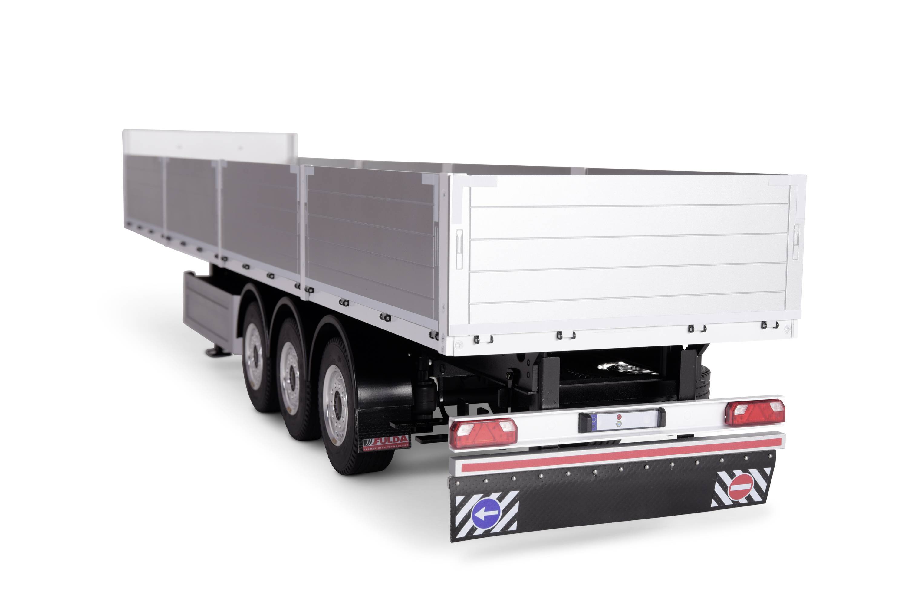 A three-axle lorry trailer with an open body and load bed, photographed from the rear. The trailer is stationary.