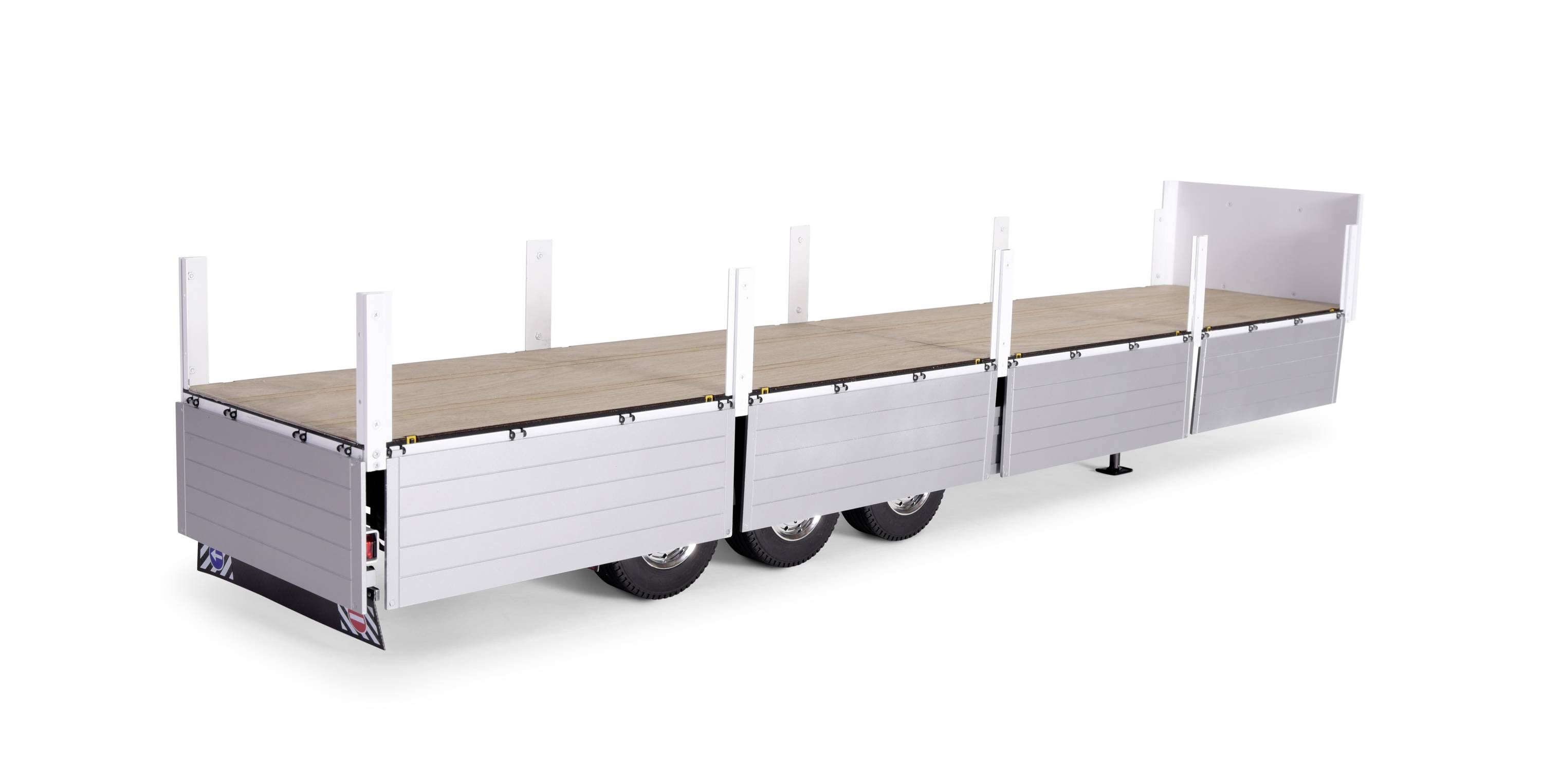 Long trailer with wooden platform and multiple axles, suitable for transporting large goods or building materials.