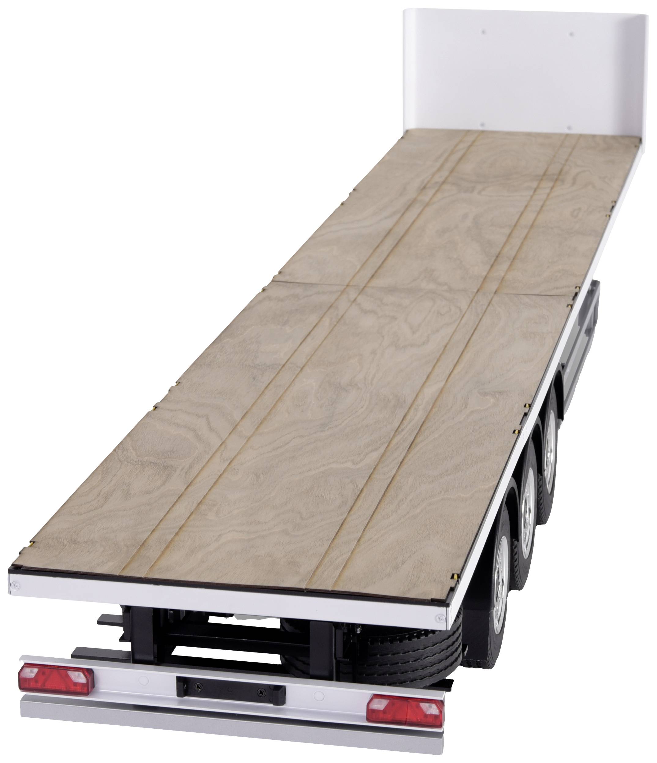 An empty three-axle trailer with a wooden platform, without side walls or roof. Suitable for transporting heavy loads.