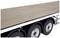 A three-axle, flat lorry trailer with a wooden platform, suitable for transporting heavy loads on the road.