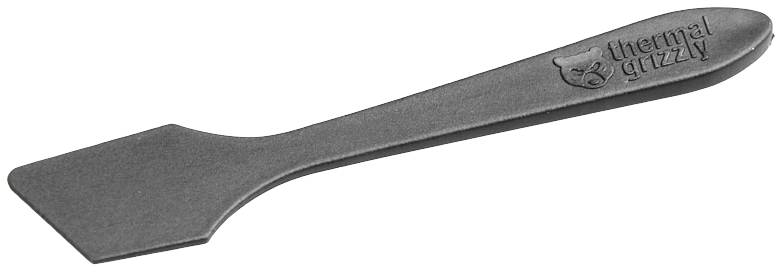 A black plastic spatula with the print 'thermal grizzly'. Used for evenly spreading thermal paste.