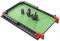 'Robot Turtles' game board with obstacles and a rotating robot. The aim is to guide the robot around the obstacles.