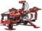 A red, remote-controlled helicopter toy with visible gears and motors, likely a model kit for children.