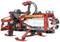 A red robotic device equipped with 'Firefighter' labelling, fitted with bottles serving as propulsion or storage units.
