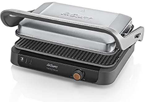 A silver contact grill with ridges and a handle on a black base. The orange button is used for temperature adjustment.