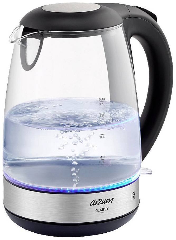 Clear, electric kettle with a black handle. Water is boiling, bubbles are visible.