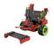 A red and green robotics kit, consisting of multiple modules and parts, including wheels and structural components.