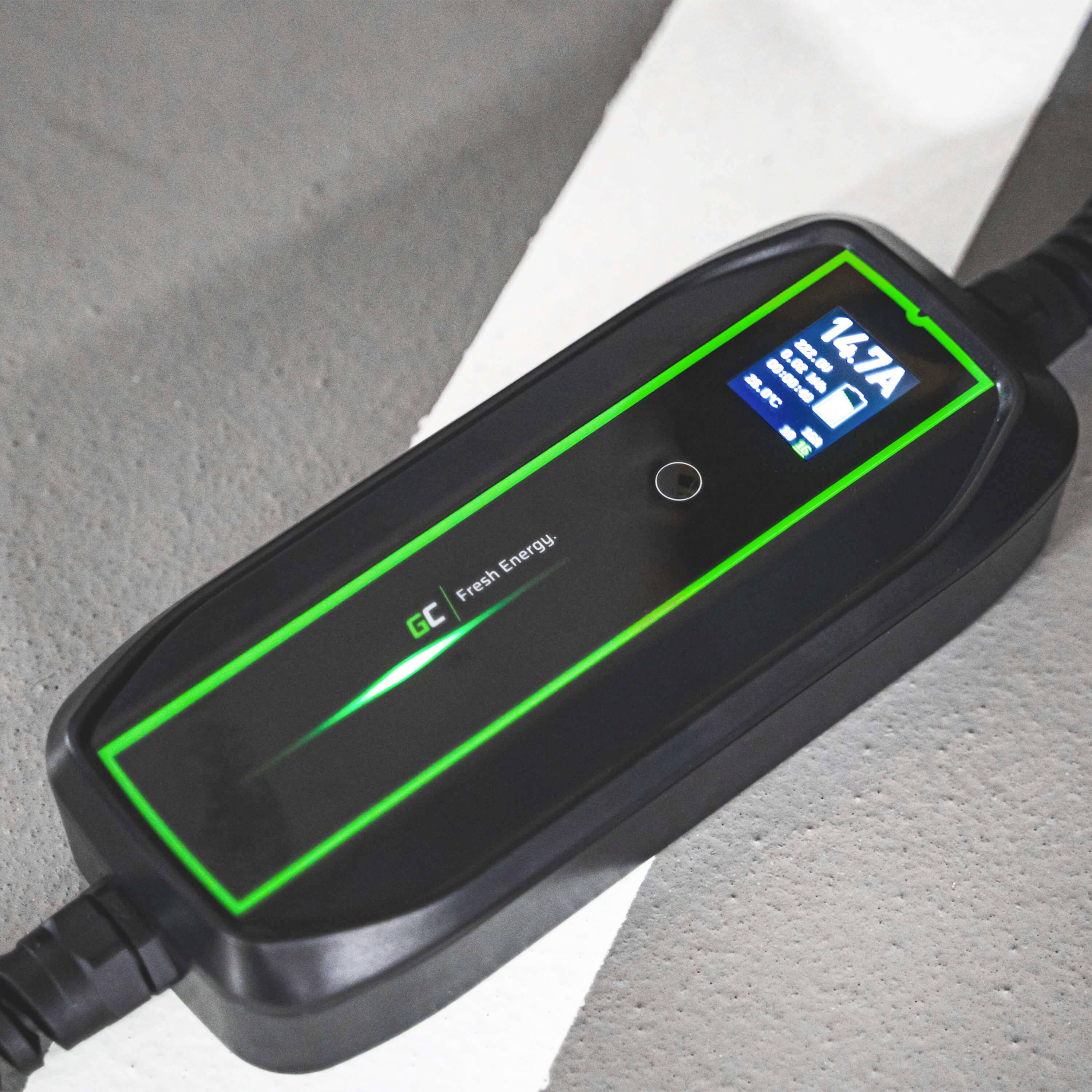 A black charger with a green frame displays a charging current of 14.7 A on its display.