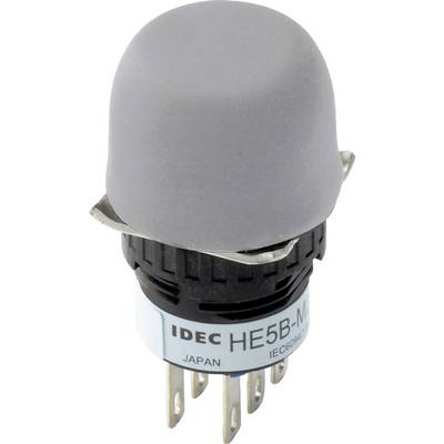 A grey operating button from IDEC with the label 'HE5B-M', suitable for control panels. Six metal contacts underneath.