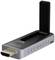 A wireless HDMI adapter with a USB port and an upright antenna, used for wireless transmission of media content.