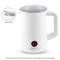 Electric milk frother with transparent lid and anti-drip spout, illuminated on/off button, white.