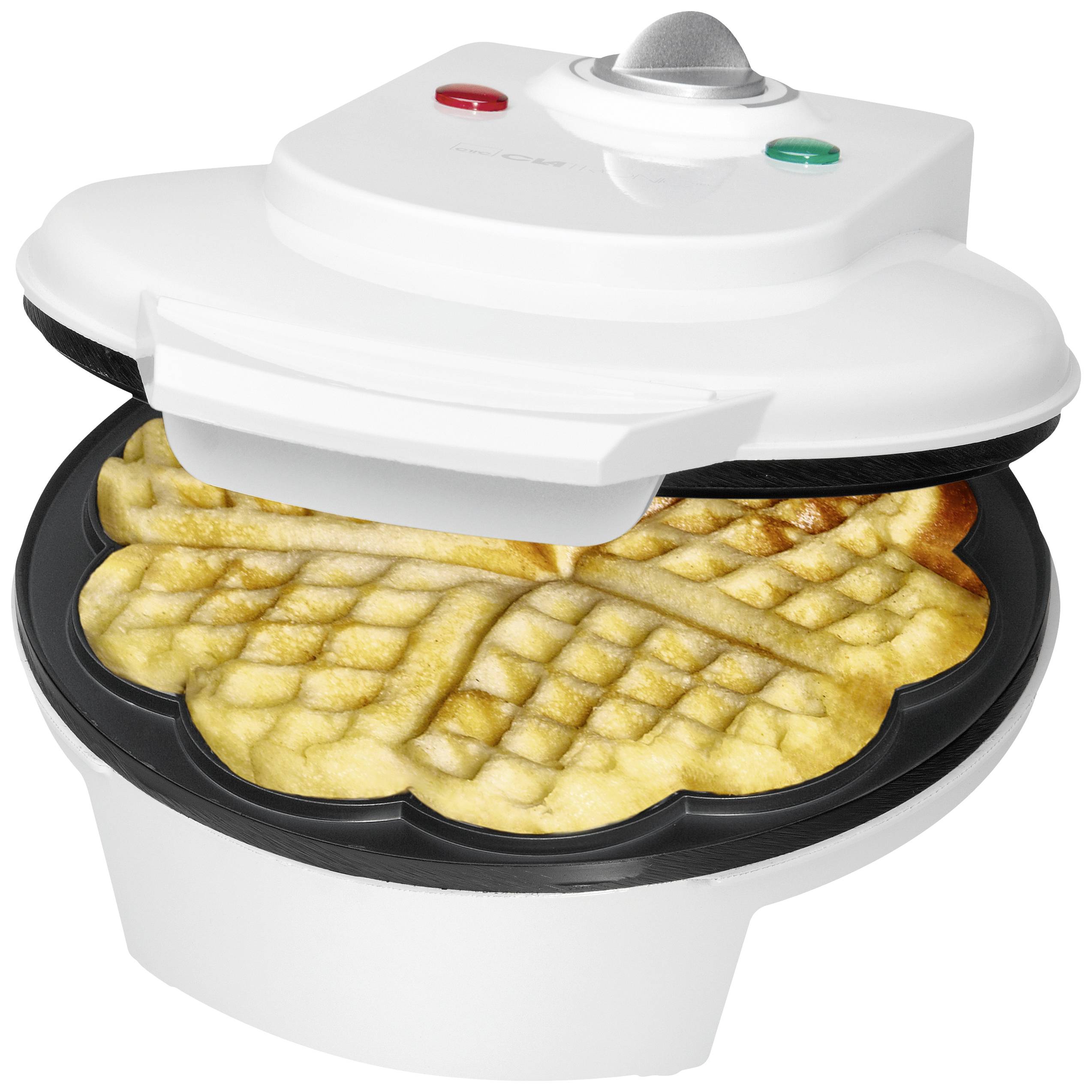 A waffle iron opened with two golden-brown waffles. A red and a green light are visible on the device.