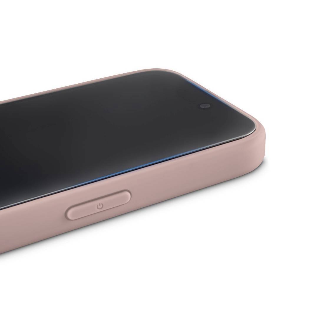 A smartphone with a pink case is lying on a table. It displays no further information or specific contents on the screen.