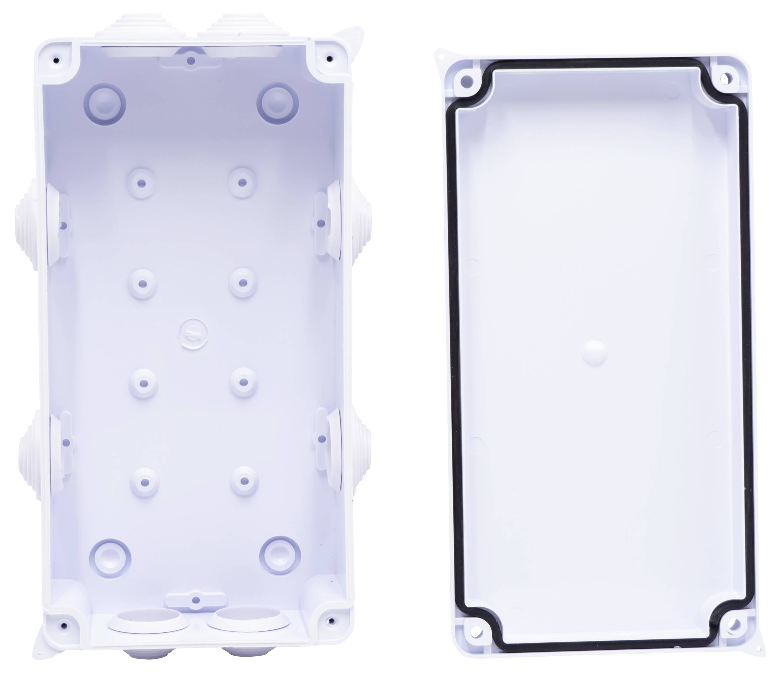 White, rectangular plastic housing halves, one side open, the other closed. Use: Protection and covering of electrical components.