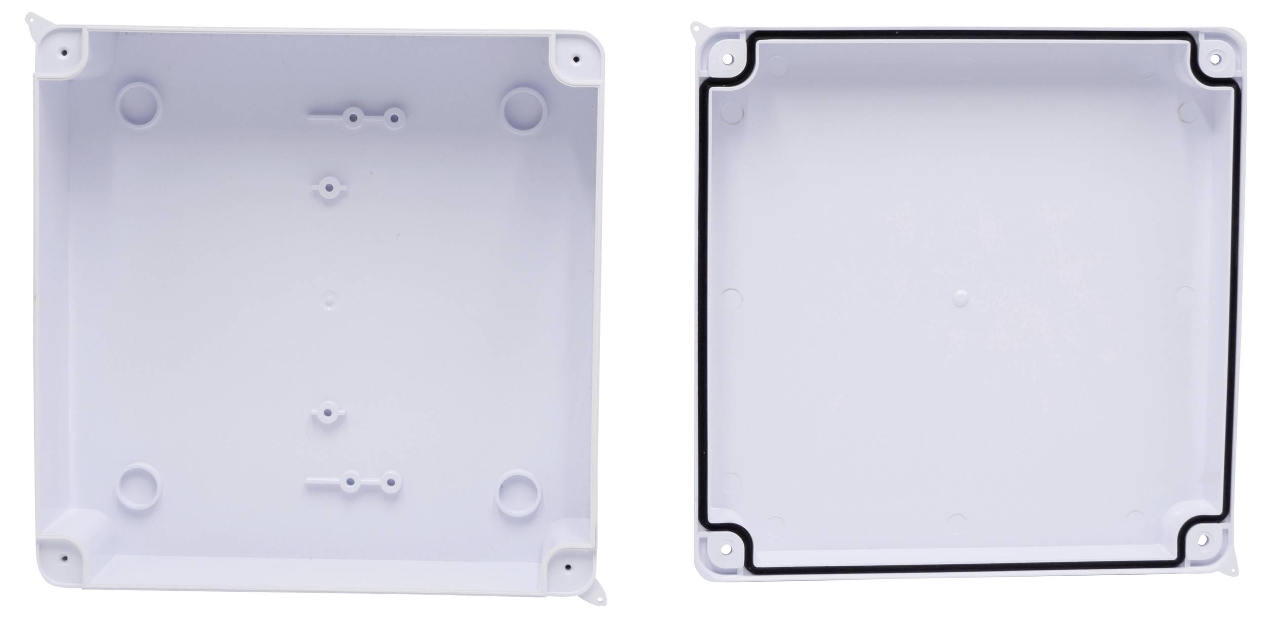 Two white plastic enclosures, shown open. The left one displays the internal structure with mounting points, the right one shows the lid with sealing gasket.