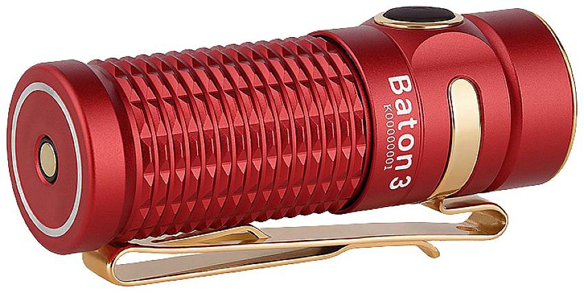 Red torch with textured surface and golden clip, printed name 'Baton 3', lying at an angle.