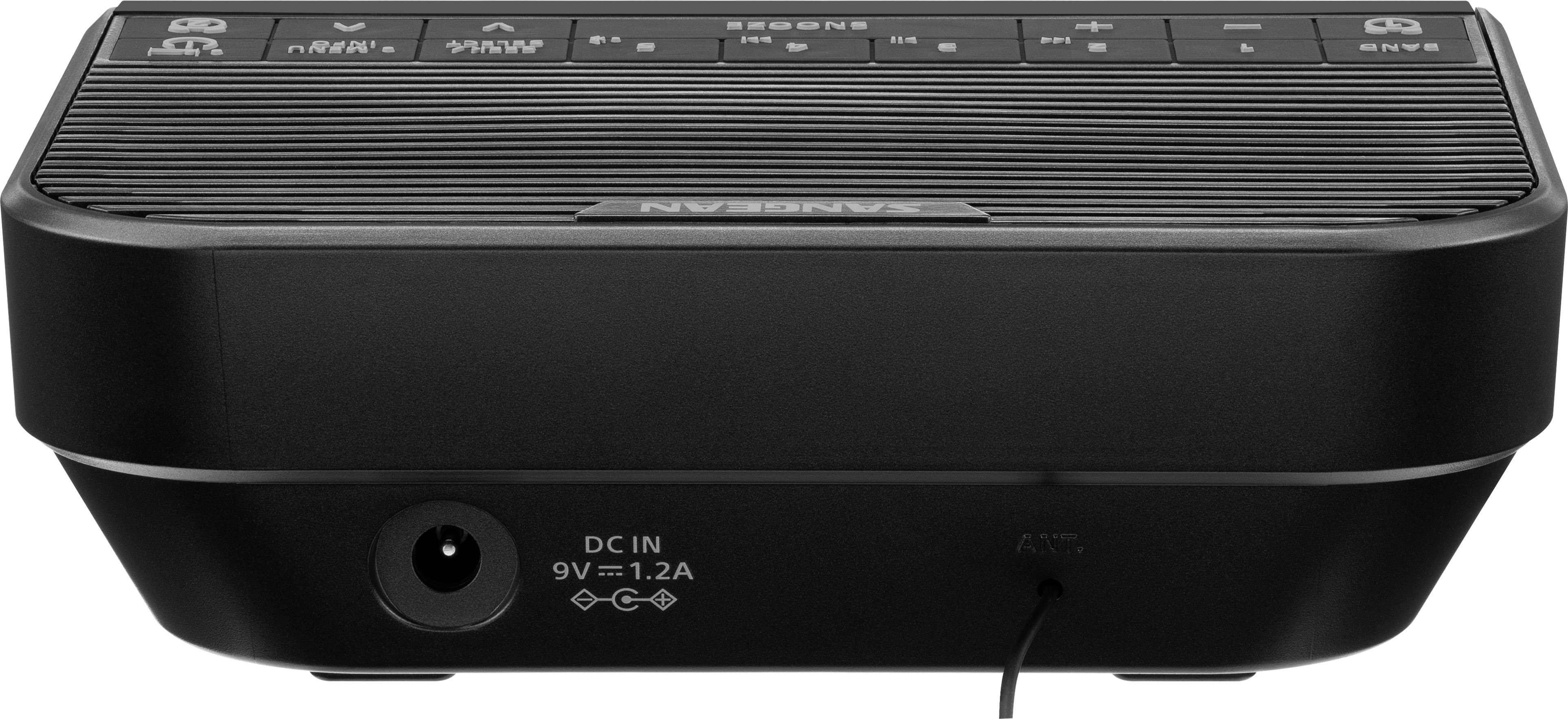 Radio with control buttons on the top surface and power connection on the rear. Manufacturer's name visible on the front.