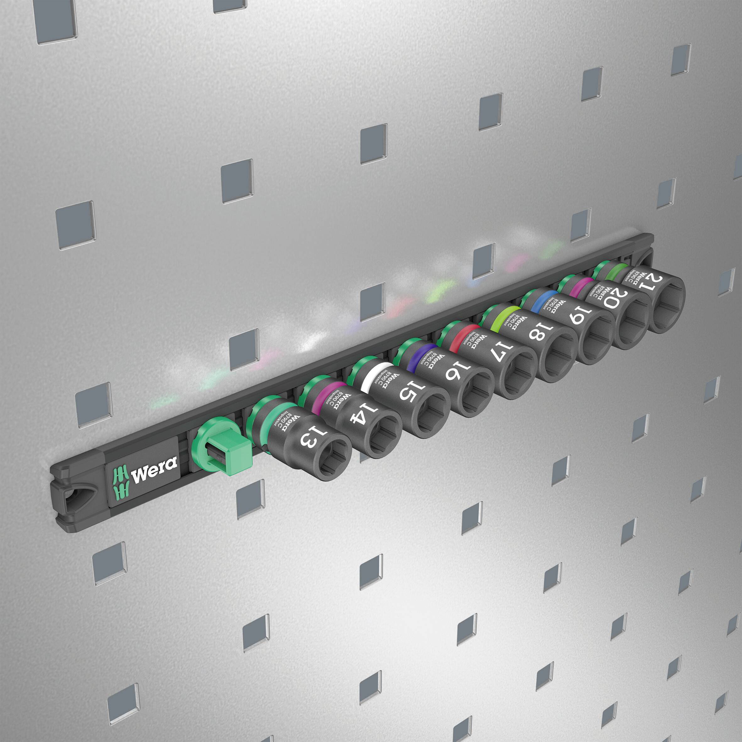A socket holder with multiple colour-coded sockets, 10 to 19 mm, mounted on a perforated metal wall.